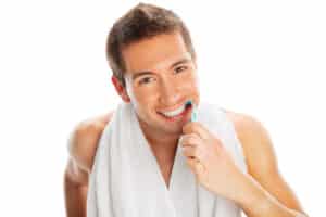 Man removing plaque for healthy gums in Williamson County, IL